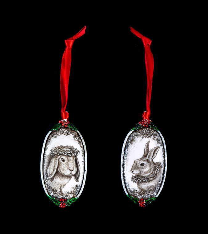 Bunny Ears Down This is a beautiful double sided ornament with a Bunny theme.  This is part of the incredible line of Mossup Valley Designs that we carry, with the wonderful artist Rachel Badeau.  The dimensions of the ornament are 3.28" x 1.61".  The SKU is MVD ORN 2.
