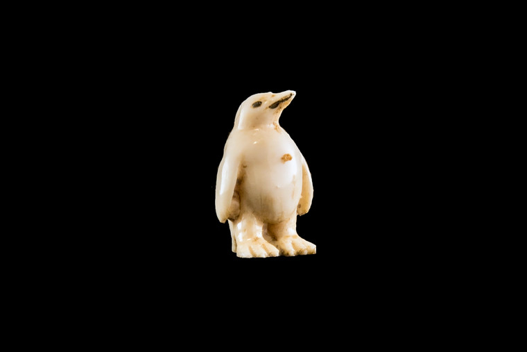 This is a beautiful hand carved eco-ivory Baby Penguin Statue.  The dimensions of the Baby Penguin Statue are 0.64" x 1.0" x .55".  The SKU is C-22.

This unique Baby Penguin Statue statue will make a great addition to any room in the house.  You can place it on any flat surface to diplay, or a great gift for children to have.

All statues are hand carved in clay.  We then make a mold of the original piece before producing them into the final acrylic resin product with an antique finish.