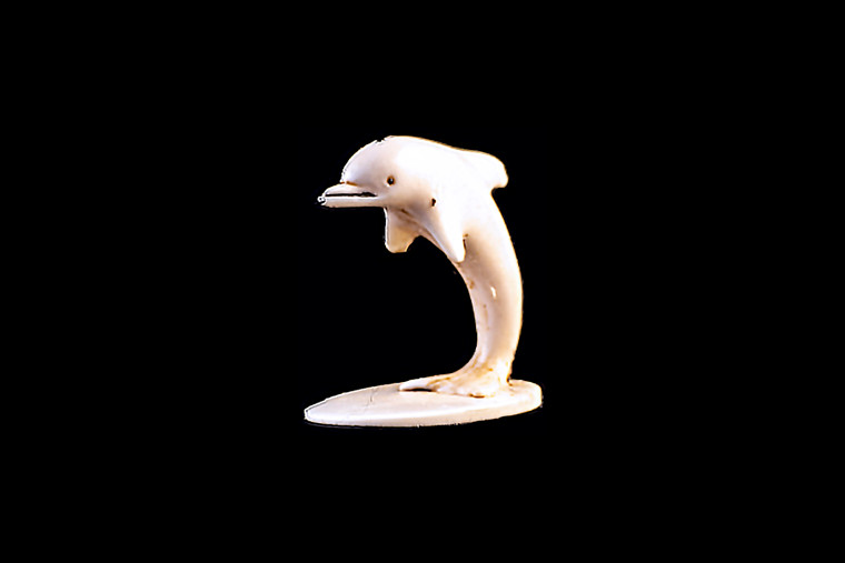 This is a beautiful hand carved eco-ivory Jumping Dolphin Statue. The dimensions of the Jumping Dolphin Statue are 1.41" x 1.35" x 1.08".  The SKU is C-57.

This decorative Jumping Dolphin Statue will make a great addition to any room in the house.  You can place it on any flat surface to display, or a great gift for children to have.

All statues are hand carved in clay.  We then make a mold of the original piece before producing them into the final acrylic resin product with an antique finish.