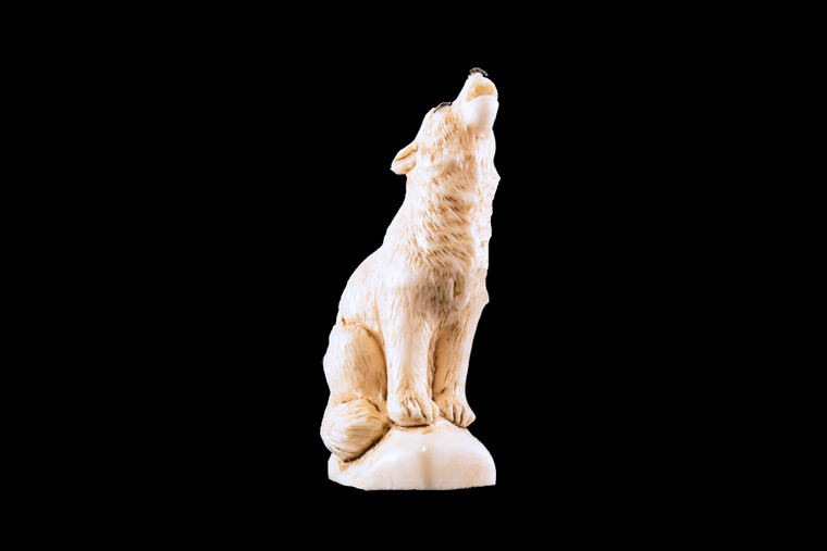 This is a stunning hand carved eco-ivory Howling Wolf Statue.  The dimensions of the Howling Wolf Statue are .70" x 2.38" x 1.55".  The SKU is C-39.  

This unique Howling Wolf Statue will make a great addition to any room in the house.  You can place it on any flat surface to display, or a great gift for children to have.

All statues are hand carved in clay.  We then make a mold of the original piece before producing them into the final acrylic resin product with an antique finish.