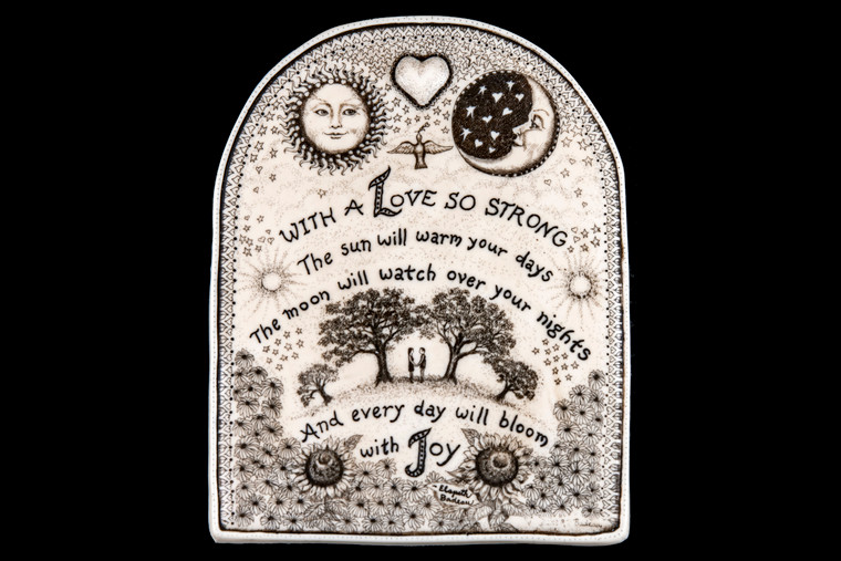 This is a beautiful wall plaque is an originally hand etched Love So Strong Wall Plaque design.  This intricate design has a couple holding hands under the Sun/Moon and Tree's.  This is part of the incredible line of Mossup Valley Designs that we carry, with the wonderful artist Rachel Badeau.  The dimensions of the plaque are 5.31" x 6.81" x 0.37".  The SKU is MVD WP 21.  Etched into the piece is a saying that flows with the design.  The saying says: " With a Love so Strong The Sun will warm your days The moon will watch over your nights And every day will bloom with Joy "  This unique design has 3D engraving intertwined into the plaque.  The heart at the top of the plaque has a 3D Heart that makes this piece truly special!