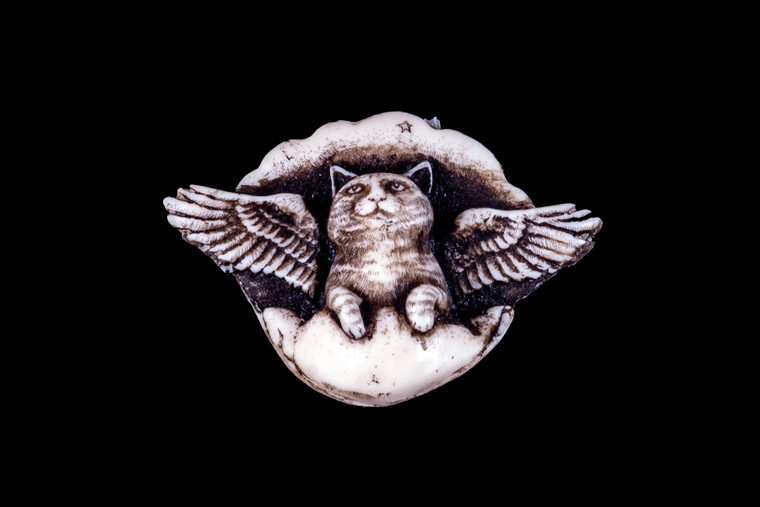 MVD PN 02 Angel Cat Zoom.  This distinct originally hand etched All Cats Go To Heaven designed pin/pendant. The backing of this piece has the findings to be a pin, as well as a pendant.  They come with an 18" Silver Plated Chain.  This is part of the incredible line of Mossup Valley Designs that we carry, with the wonderful artist Rachel Badeau.  The dimensions of the necklace are 2.00" x 1.41" x 0.72".  The SKU is MVD PN 2.

Rachel Badeau has been etching and engraving in a variety of media for over thirty years.  Her work, characterized by fine line and intricate detail, attempts to touch the hearts and emotions of others.  All while reflecting her love of animals, nature and the human spirit.  

The resin scrimshaw piece is originally hand etched by Rachel Badeau.  We make a mold of the original piece and do an open cast pour of our resin mixture.  The pieces are removed from the mold and sanded and inked.