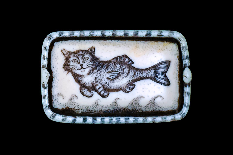 This distinct originally hand etched CatFish designed pin/pendant.  The backing of this piece has the findings to be a pin, as well as a pendant.  They come with an 18" Silver Plated Chain.  This is part of the incredible line of Mossup Valley Designs that we carry, with the wonderful artist Rachel Badeau.  The dimensions of the necklace are 1.67" x 1.04" x 0.37".  The SKU is MVD PN 44.

Rachel Badeau has been etching and engraving in a variety of media for over thirty years.  Her work, characterized by fine line and intricate detail, attempts to touch the hearts and emotions of others.  All while reflecting her love of animals, nature and the human spirit.  

The resin scrimshaw piece is originally hand etched by Rachel Badeau.  We make a mold of the original piece and do an open cast pour of our resin mixture.  The pieces are removed from the mold and sanded and inked.