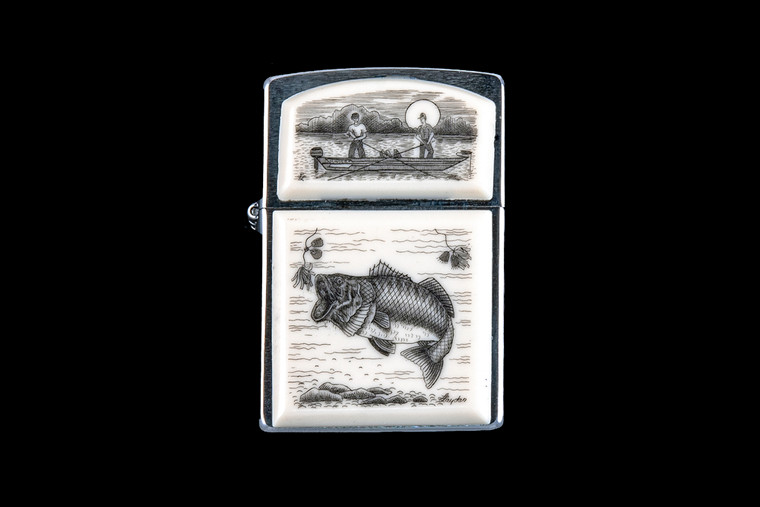 This is a beautifully originally hand etched Eco-Ivory Scrimshaw Large Mouth Bass Designed Zippo! The top of the flip lighter has a a fisherman design.  The Zippo is a Brushed Chrome finish. Each lighter has a bottom stamp signifying the year it was made, is refillable. All windproof lighters are American made in Bradford, PA factory and come packaged in a gift box.  This is part of the Save the Elephant Collection and was originally hand etched by Linda Layden.  The SKU is NC 54 - 101.

The Zippo Lighter is 2.24" x 1.51" x 0.59".  It weighs 2.04 oz.