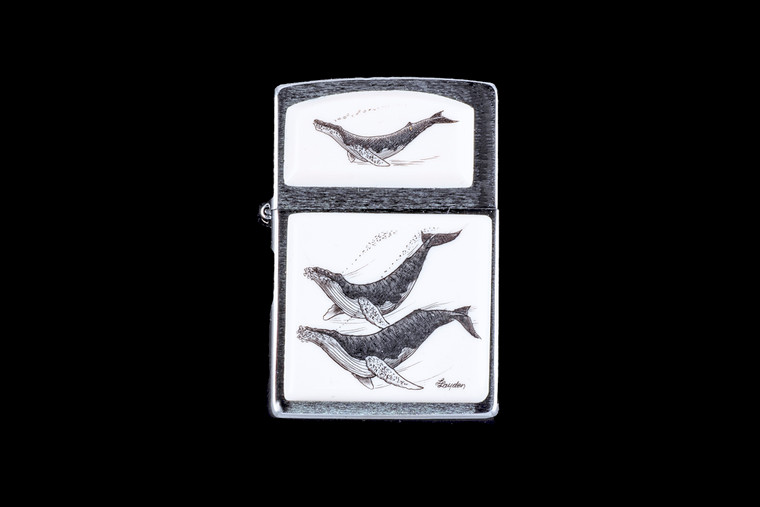 This is a beautiful Nautical originally hand etched Eco-Ivory Scrimshaw pair of Humpback Whales designed Zippo Lighter! The top of the flip lighter has a Humpback design.  The Zippo is a Brushed Chrome finish. Each lighter has a bottom stamp signifying the year it was made, is refillable. All windproof lighters are American made in Bradford, PA factory and come packaged in a gift box.  This is part of the Save the Elephant Collection and was originally hand etched by Linda Layden. The SKU is NC 54 - 402.

The Zippo Lighter is 2.24" x 1.51" x 0.59".  It weighs 2.04 oz.