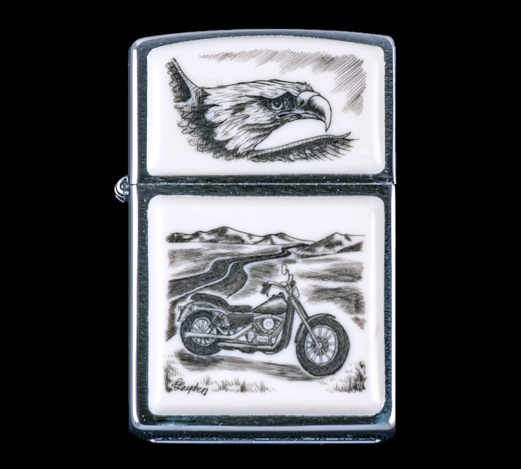 This is a unique originally hand etched Eco-Ivory Scrimshaw Motorcycle Designed Zippo! The top of the flip lighter has a Eagle Face design.  The Zippo is a Brushed Chrome finish. Each lighter has a bottom stamp signifying the year it was made, is refillable. All windproof lighters are American made in Bradford, PA factory and come packaged in a gift box.  This is part of the Save the Elephant Collection and was originally hand etched by Linda Layden.  The SKU is NC 54 - 210.

The Zippo Lighter is 2.24" x 1.51" x 0.59".  It weighs 2.04 oz.
