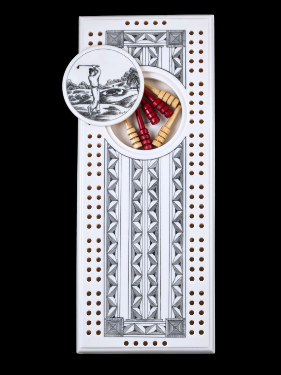 This wonderful two person and our two team cribbage boards is a beautiful accent piece for your home or take it on the road for use as a travel cribbage board.  With the magnet holding the center piece and pegs in place it is a stunning travel cribbage board. 

This is a beautiful originally hand etched Golfer Eco - Ivory Scrimshaw Cribbage Board!   The center circular piece has a magnet holding it in place.  Pushing on the base of the piece pops the Large round off the board, where the pegs are stored.  All cribbage boards come with 3 red and 3 white/yellow wooden pegs. 

The cribbage board itself is made for two players or teams.  The board has a native geometric design that was originally hand etched.  The large round piece has a magnet on the back to keep it secured to the board and store the pegs.  The pegs are made of wood.  This is part of the Save the Elephant Collection and was originally hand etched by Linda Layden.  The SKU is NC 53 - 152.

The Cribbage Board is 8.50" x 3.46" x 0.46".  It weighs 11.28 oz.