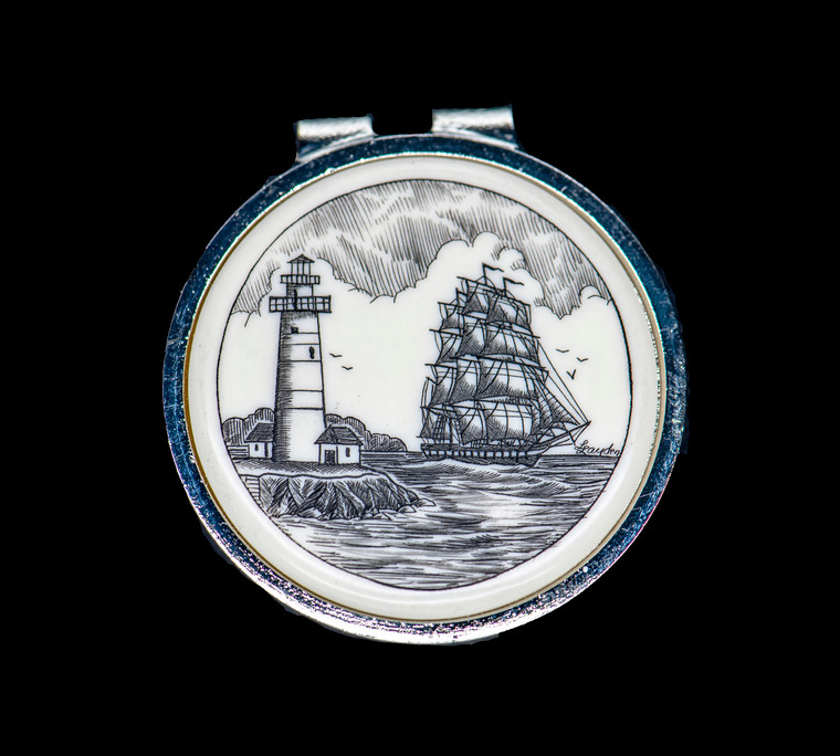 Ship and Light Money Clip.This stunning originally hand etched Scrimshaw Ship and Lighthouse design on a Rond Spring Money Clip.  This unique piece is a spring money clip.  The back of the money clip has a stainless steel spring that will hold your money secure.  Regardless if it is a small or large stack of bills.  

The artwork was originally hand etched by Linda Layden.  The artistic insert is an 1.5", the size of a silver dollar.  The dimensions of the Large Rectangle Money Clip is 1.68" x 1.81" x 0.46".  The SKU is NC 24 - 406.