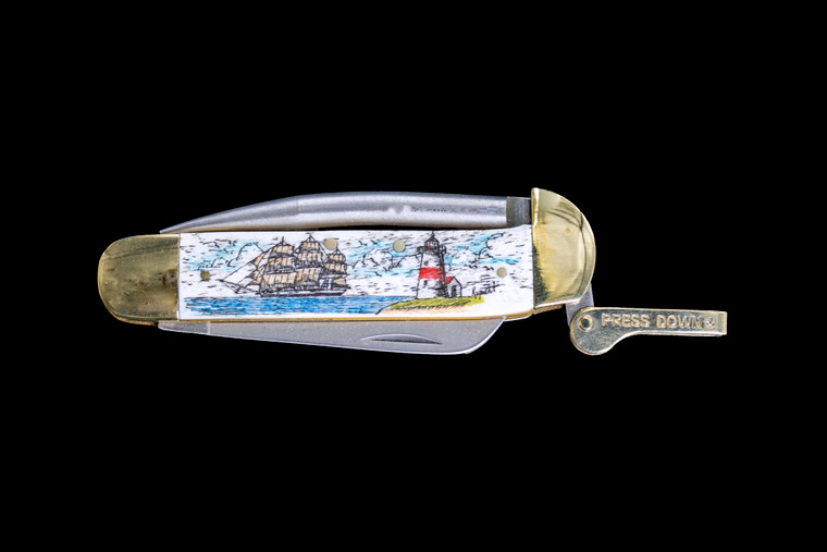 This stunning hand etched Ship and Lighthouse Colored Design on a 440 Stainless Steel Blade Marlin Spike with a foldable bladed knife.  The Marlin Spike has a lock feature, while the knife blade is foldable.

This beautiful knife is part of the Scrimshaw Collection, with those words laser engraved into the blade.  The MS knifes come with the pictured leather sheath and each scale is made with Bovine Bone.  The MS Knife has bolsters and shackle that are nickel silver with brass pins and liner.  It is a lock blade Marlin Spike with a very useful pocket knife. The Marlin Spike is made of Stainless Steel.  The dimensions of the MS Knife with the blade closed are 4.11" x 2.17" x 0.69".  The blade itself is approximately 2.91" making the width of the knife with an open blade 7.02".  The Marlin Spike is 3.05" long.  The SKU is MS 406C.