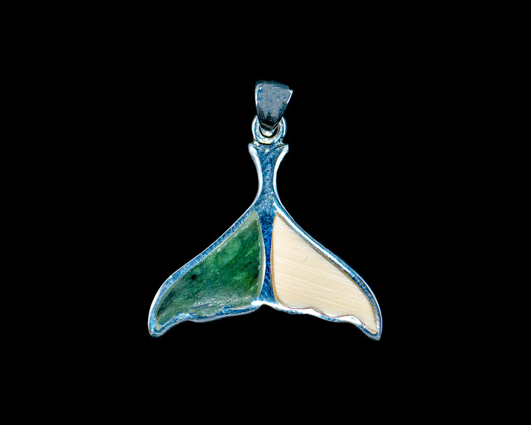 Medium Alaskan Jade Whale Tail Sterling Silver Pendant Zoom

This unique medium whale tail shaped piece of Alaskan Mammoth and Jade is inlayed into a sterling silver pendant.  This pendant comes with an 18" Sterling Silver chain.  The dimensions of the Alaskan Mammoth Jade pendant is approximately .88" x .93".  The product id # is PMJ-1066-S.

Genuine Jade (nephrite) is a fascinating gemstone and the state gem of Alaska. In prehistoric times, prized for its toughness, jade was used to make weapons, tools and later simple ornaments. Jade purportedly can protect you from evil, attract love and of course bring you good luck. It is now regarded as a symbol of energy and beauty. Stimulating creativity and mental agility along with harmony and balance. The jade we use comes from the Nana Region of Alaska.