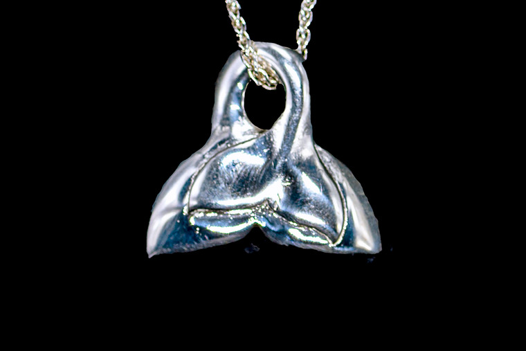 Sterling Silver Double Whale Tail Pendant Zoom.  This originally hand carved Sterling Silver Double Whale Tail is a beautiful pendant.  This unique pendant comes with an 18" Sterling Silver Chain.  The measurements of the earrings are approximately .96"x .95". The product ID is SS-2WT.

The Sterling Silver is 925.  It is engraved with a 925 and Made In the USA.  

This stunning piece can be used as a Mother and Daughter Piece.  

All pendants come boxed.