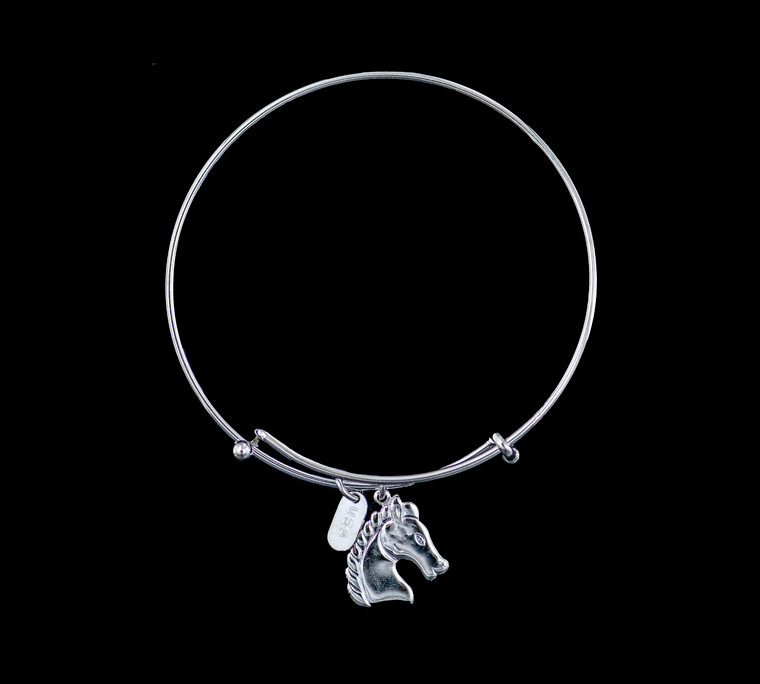 The beautiful adjustable bracelet is decorated with a Horse charm.  The product ID is NC 07-134-S.

This bracelet is a one size for most, with an adjustable wire band.  Each bracelet can be customized with different unique charms to attach.  All parts are made in the USA!.

The silver bracelets are steel with rhodium plating.  They are e-coated to help prevent tarnishing.

The Horse charm is a lead free casted pewter.