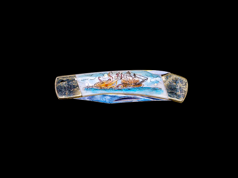 This distinct hand etched Octopus and Ship Colored design on on a 440 Stainless Steel Blade LB 5 Knife.  The stunning design has a giant Octopus attacking a tall ship at sea.  This beautiful knife is part of the Scrimshaw Collection, with those words laser engraved into the blade.  The LB 5 knifes come with the pictured leather sheath and each scale is made with Bovine Bone.  The LB 5 Knife has bolsters and shackle that are nickel silver with brass pins and liner.  It is a lock blade knife and a very useful pocket knife. The dimensions of the LB 5 Pocket Knife with the blade closed are 3.71" x 0.90" x 0.39".  The blade itself is approximately 2.80" making the width of the knife with an open blade 6.51".  The SKU is LB-5 409C.