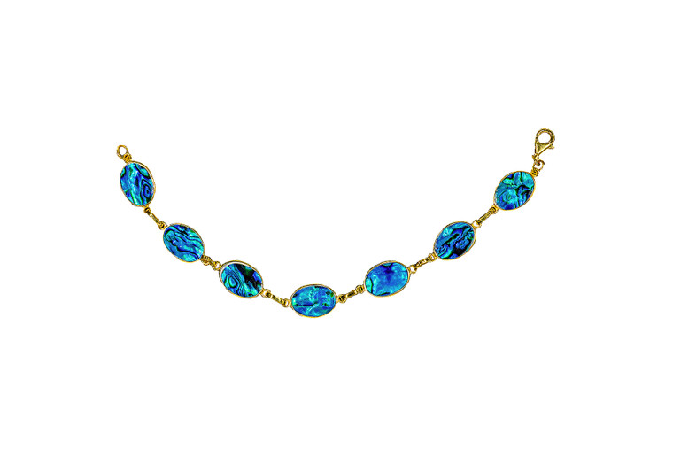 Oval Shaped Northern Lights 22K Gold Plated Bracelet | F&F Inc.

This stunning Oval Paua Shell is inlayed into a stunning graduated oval shaped 22K Gold Plated bracelet.  The dimension of the bracelet is approximately 7.2" x .482".  The product id # is BRNL-1070-G.                  

This is our line of PĀUA Shell Jewlrey.  In New Zealand, abalone is called pāua or blackfoot pāua is the ubiquitous New Zealand pāua the highly polished nacre of which is extremely popular as souvenirs with its striking blue, green, and purple iridescence that allows for the stunning jewlery.

It is a 22K plate on sterling silver. The plating is with 30mils of 22K gold. Typically plating is done with 3mils of gold. We work with the extra gold plating to ensure your beautiful jewelry piece will have a strong gold color for years to come!!  

Enjoy your unique bracelet!!