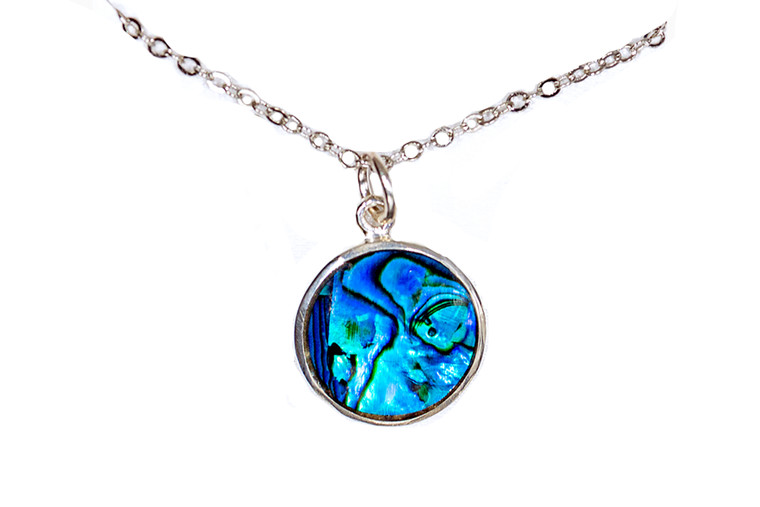 Circular Northern Lights Sterling Silver Pendant | F&F Inc.

This impressive Circular Shape Northern Lights piece is inlayed into a sterling silver pendant.  This pendant comes with an 18" Sterling Silver chain.  The dimensions of the Northern Lights pendant is approximately .628".  The product id # is PNL-1089-S.

This is our line of PĀUA Shell Jewelry.  In New Zealand, abalone is called pāua or blackfoot pāua is the ubiquitous New Zealand pāua the highly polished nacre of which is extremely popular as souvenirs with its striking blue, green, and purple iridescence that allows for the stunning jewelry.

Enjoy your unique piece of jewelry!
