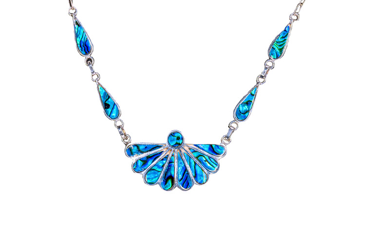Fan Shape Northern Lights Sterling Silver Pendant | F&F Inc.

This impressive Fan Shape Northern Lights piece is inlayed into a sterling silver pendant.  This pendant comes with an 18" Sterling Silver Link Chain.  The dimensions of the Northern Lights pendant is approximately 1.41" x .86" for the main pendant. The teardrop side pieces are .23" by .63". The product id # is PNL-1011-S.

This is our line of PĀUA Shell Jewelry.  In New Zealand, abalone is called pāua or blackfoot pāua is the ubiquitous New Zealand pāua the highly polished nacre of which is extremely popular as souvenirs with its striking blue, green, and purple iridescence that allows for the stunning jewelry.

Enjoy your unique piece of jewelry!

Features:

Northern Lights
Paua Shell
Fan Shape Pendant
Tear drop pieces
18" Sterling Silver link chain
Sterling Silver
Lifetime Guarantee!!