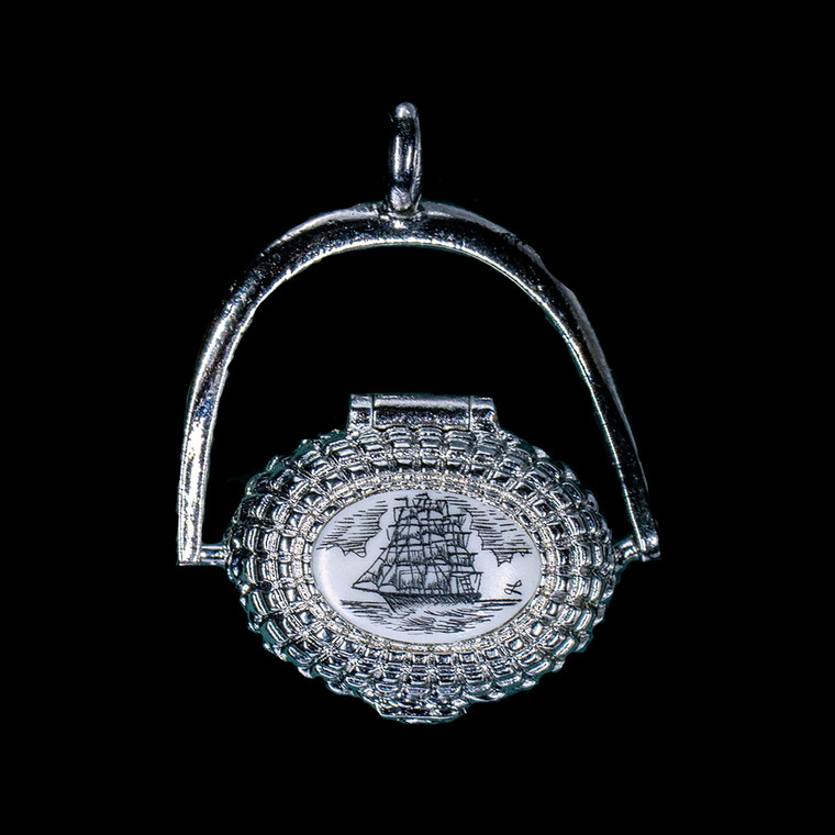This is a beautifully detailed Sterling Silver Plated Nantucket Basket Pendant with a replica scrimshaw Tall Ship design.  More specifically the ship is that of a Whaling Bark. Inside the basket is a mini penny.  The basket on it's own has the following dimensions, .78"x .48"x .77".  The pendant holder add .22" x .85".  Each pendant weighs .31 ounces.  All the pendants come with an 18" Sterling Silver chain. The item number is SNB 4012.

This Nantucket Lightship basket pendant is made in pewter and was plated in Sterling Silver.  These beautiful baskets are similar to what is seen on the Netflix hit, Sirens

Nantucket lightship baskets, characterized by their rattan staves, cane weavers, and wooden bases, originated on the island's lightships in the mid-1800s. Initially, these baskets were a way for lightship crewmen to pass the time during long deployments and were primarily utilitarian. Over time, the baskets evolved, becoming more refined and sought after as souvenirs of Nantucket.

Keeping with the tradition of a penny in the basket.  A penny is placed inside the basket to symbolize good luck.  Each of our basket pendants have a mini penny inside to carry on the tradition.  

Linda Layden has been making beautiful works of art in the scrimshaw field for over 40 years.  Originally a hobby that became a full time job.  Her work can be found in gift shops, galleries and museums across the world.  

The resin scrimshaw piece is originally hand etched by Linda Layden.  We make a mold of the original piece and do an open cast pour of our resin mixture.  The pieces are removed from the mold and sanded and inked with Indian Ink.

We believe that serving nature is one of the commissions that we as humans have been given here on earth.  We wish to lend our resources to those charged with protecting elephants from poaching.  On a monthly basis we donate to organizations whose purpose to protect the elephants and other species throughout the planet.  We focus our donations on organizations that put the money to good use and have a low overhead. With the majority of incoming funds going back to saving the elephants!

American Made
Nantucket Basket Pendant
Sterling Silver Plated
Pewter Base 
Mini Penny 
18" Sterling Silver Chain
Nautical Design Top

Etched Tall Ship
Whale Bark
Resin Scrimshaw
Lifetime Guarantee