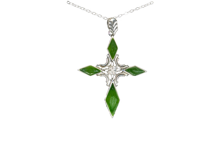 Unique Cross Alaskan Jade Sterling Silver Pendant | F&F Inc. | F&F Inc.

This is a unique cross pendant with Alaskan Jade.  The measurements of the pendant are approximately 1.2" x 1.5".  The product ID is EJ-1109-S.

Genuine Jade (nephrite) is a fascinating gemstone and the state gem of Alaska. In prehistoric times, prized for its toughness, jade was used to make weapons, tools and later simple ornaments. Jade purportedly can protect you from evil, attract love and of course bring you good luck. It is now regarded as a symbol of energy and beauty. Stimulating creativity and mental agility along with harmony and balance. The jade we use comes from the Nana Region of Alaska.

Enjoy your unique piece of history!

Features:
Alaskan Jade
Unique Cross Design
Sterling Silver
Lifetime Guarantee!!