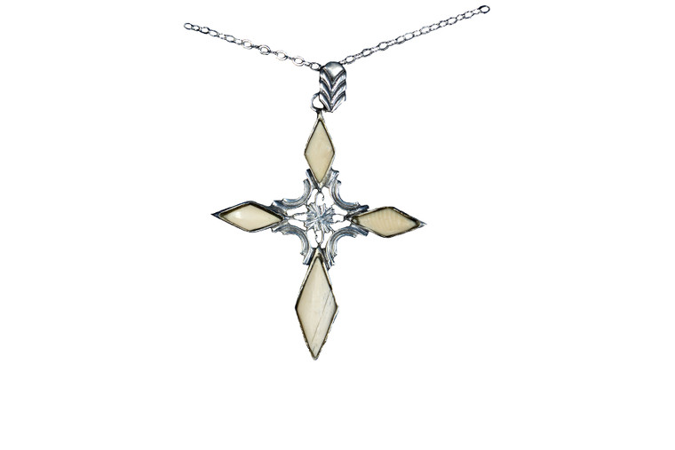 Unique Cross Alaskan Mammoth Sterling Silver Pendant | F&F Inc.

This is a unique cross pendant with Alaskan Mammoth.  The measurements of the pendant are approximately 1.2" x 1.5".  The product ID is EJ-1109-S.

The pre-historic Mammoth tusks are found as a bi - product of the gold mining industry in Alaska. They are carbon dated to be approximately 25,800 years old.  The color of your mammoth tusk may vary due to the minerals in the ground water where the tusks are buried.  The varying color of the mammoth tusks make each piece of jewelry unique. Cracks and splits in the ivory occur naturally due to it’s great age.  Our materials are considered eco-friendly because no animals were harmed in the making of this beautiful piece of jewelry. 

All pendants come boxed with a Mammoth Ivory story card.

Enjoy your unique piece of history!

Due to State law, the sale of antique Mammoth Ivory is not allowed to be sold in the following states. California, Hawaii, Nevada, New Jersey, New York, and Oregon.  If the product is to be shipped to these states, the order will be cancelled and you will be notified!

Features:

Alaskan Mammoth
Unique Cross Design
Sterling Silver
Lifetime Guarantee!!