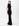 A model wears a long black dress with a mock neck and cap sleeves.