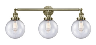 Franklin Restoration Three Light Bath Vanity in Antique Brass (405|205-AB-G204-8)