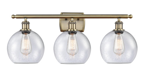 Ballston Three Light Bath Vanity in Antique Brass (405|516-3W-AB-G124-8) Ballston Three Light Bath Vanity in Antique Brass (405|516-3W-AB-G124-8)