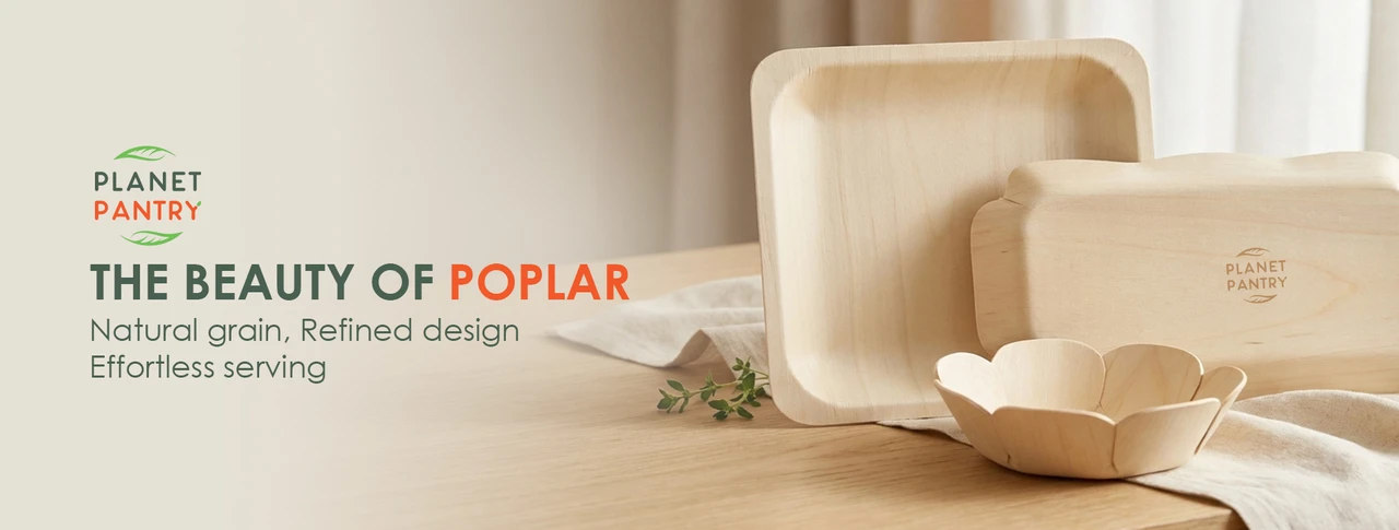 Close-up of Planet Pantry poplar wood plates, trays, and bowl showcasing the natural wood grain and simple design.