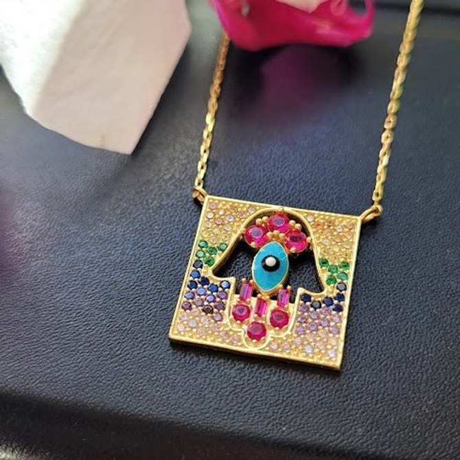 Intricate Gemstone Hamsa Pendant in Gold