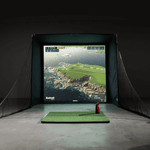 Indoor golf simulator displaying a realistic coastal course.