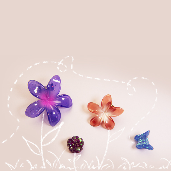 flower hair clips on a cream background