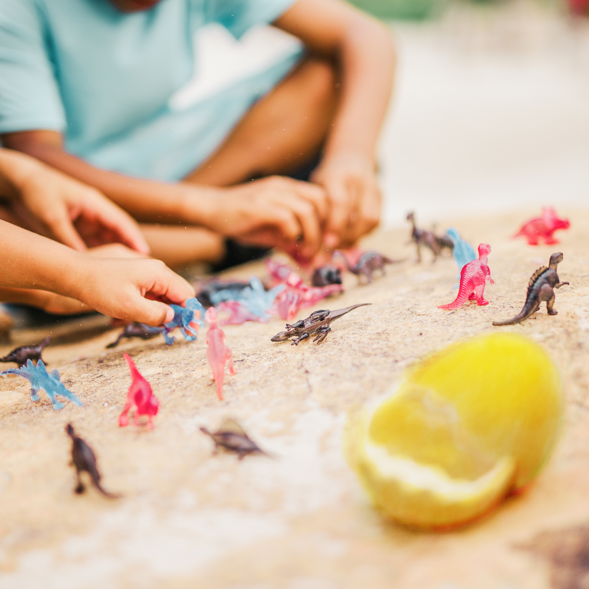 color changing dino toys on the beach