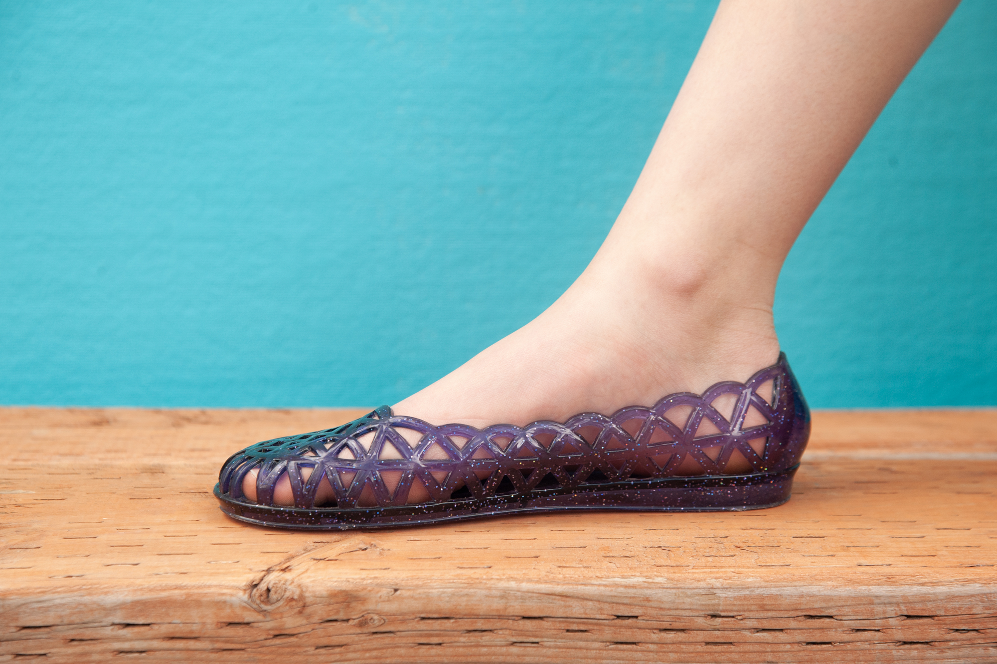 purple color changing shoes on a blue background