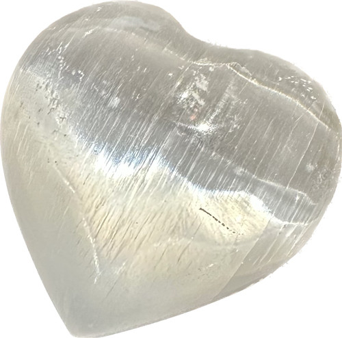 Carved 2.5" width Selenite heart.
Selenite: Named after the Greek goddess of the moon Selene. Utilized to cleanse and charge other crystals. Protective stone that shields one from outside influences.