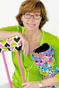 Annette, founder of CastCoverz and You Heal Here, displaying colorful orthopedic recovery covers