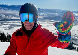 Weather & Outdoors: Skier wearing a waterproof mitten cast cover to protect an injured arm from snow