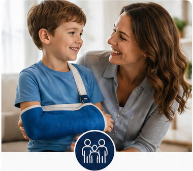 Parents & Kids: Mother comforting her son while he wears an arm sling at home