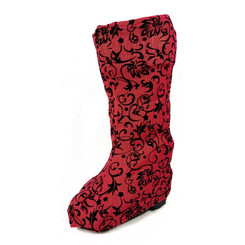 A rose colored background with barely-there strands of gold compliment the black flocked scroll pattern.  Gorgeous fabric.  For the sumptuous-minded boot wearer. :)