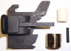 MAT - EDI PUSHER ASSEMBLY #01D0FF, image showing disassembled industrial pressing or assembly tool components including a large black metal part, a white rubber wheel, a brass cylindrical part, a small black rod, and a small white rubber component.