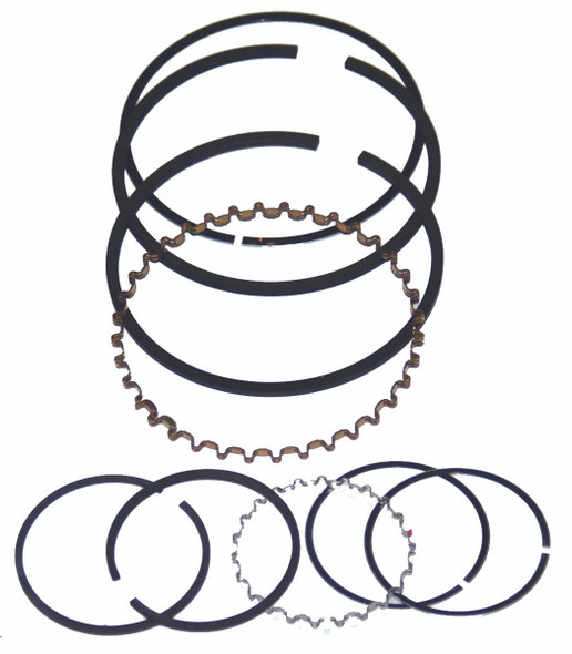 Air Compressor Sales Kellogg 352 Pump Ring Set #0195BB, image of multiple black piston rings and a metallic ring with wavy edges arranged on a white background.
