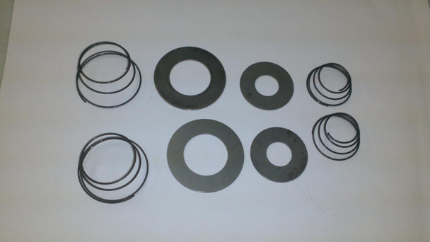 Air Compressor Sales Valve Repair Kit - Springs Discs 335 #01879F, image showing metal discs and rubber rings used for valve repair in air compressors.
