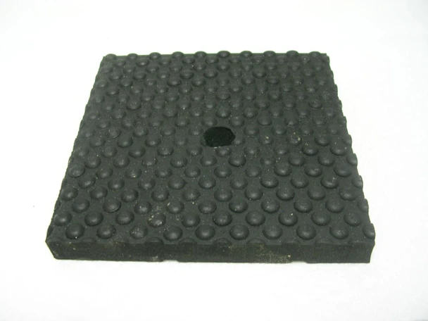 Chicago Pneumatic Vibration Pad, 4 inches by 4 inches by 1/2 inch, black textured rubber with rounded bumps and a central hole.
