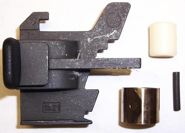 MAT - EDI PUSHER ASSEMBLY #01D0FF, image showing disassembled industrial pressing or assembly tool components including a large black metal part, a white rubber wheel, a brass cylindrical part, a small black rod, and a small white rubber component.
