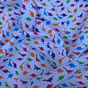 Small Multicoloured Dinosaurs Polycotton Fabric, White