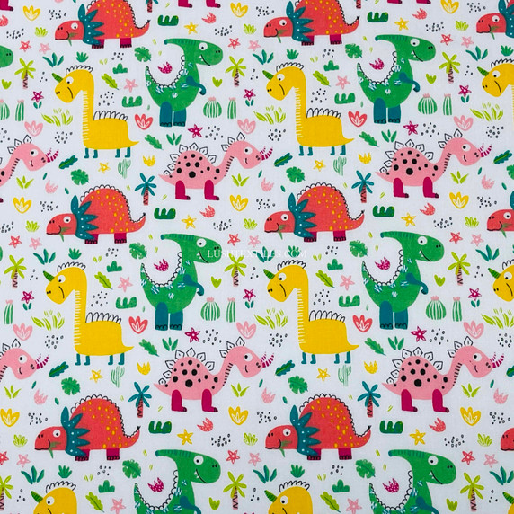 Kids colourful dino/dinasours printed Polycotton dressmaking crafts quilting dolls house Fabric by Prestige Fashion