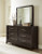 Neymorton Queen Upholstered Panel Headboard, Dresser and Mirror (B618B6)