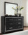 Kaydell - Black - 7 Pc. - Dresser, Mirror, Queen Upholstered Panel Bed With 2 Storage Drawers, 2 Nightstands