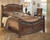 Leahlyn - Warm Brown - 5 Pc. - Dresser, Mirror, California King Panel Bed