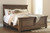 Flynnter - Medium Brown - 6 Pc. - Dresser, Mirror, Chest, California King Panel Bed