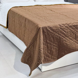 brown organic bed coverlet