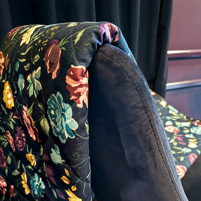 floral blanket on the back of a chair